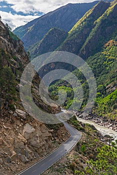 Alpine road going through mountain valley