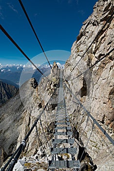 Alpine rope suspension bridge. Sentiero dei fiori, Tonale, Italy