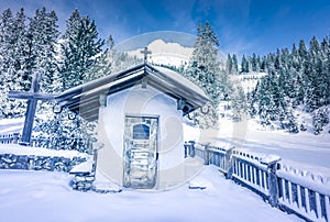 Alpine rustic chapel in winter decor