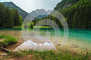 Alpine scenery with mountains and turquoise lake in Slovenia