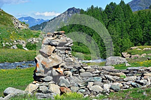 The alpine scenic landscapes of mountains, meadows and flowers at Dondena, Aosta Valley, Italy in natural reserve of Mount Avic