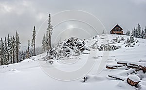 Alpine Shelter in Snow Field on Cloudy Day