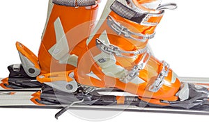 Alpine ski boots in ski binding closeup