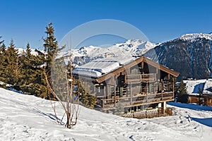 Alpine ski resort with chalet and trees