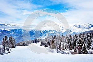 Alpine ski slope in Mont-Blanc Alps mountains view