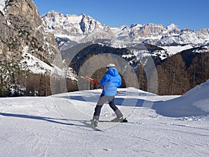 Alpine Skiers Descending a Beautiful Snowy Slope and a view of the Beautiful Surrounding Landscape of the Snow-covered of the