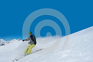 Alpine skiing descends the steep slope