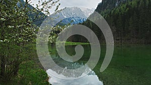 Alpine spring landscape with mountain lake