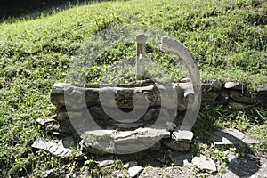 Alpine style wooden fountain in Italy