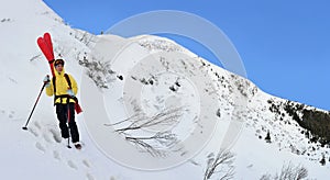 Alpine touring skier in winter mountain