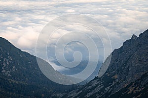 Alpine valley shrouded by clouds and framed by mountains, Slovakia, Europe