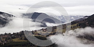 Alpine village in the fog. France, rhone-Alpes