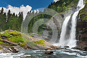 Alpine waterfall in mountain forest