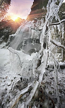 Alpine waterfall in winter