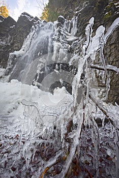 Alpine waterfall in winter