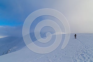 Alpine winter scenery, with fresh snow and mist, on a bright day