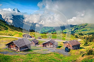 Alpine wooden farmhouses and mountain farmland, Grindelwald, Bernese Oberland, Switzerland