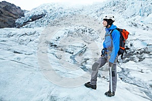 Alpinist climber on glacier