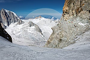Alpinist climbing  Dent du Geant cliff, mountains landscape view