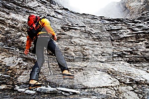 Alpinist climbing Eiger Peak photo