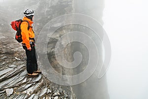 Alpinist climbing Eiger Peak photo