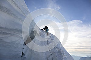 Alpinist climbs Mont-blanc du Tacul  three mounts route, par les 3 monts in the French Alps, Chamonix-Mont-Blanc, France
