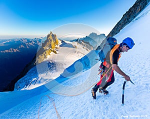 Alpinist mountaineer climbing snow ice mountain slope