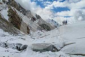 Alpinist rope team on the glacier way to Ibn Sina, Avicenna or Lenin Peak