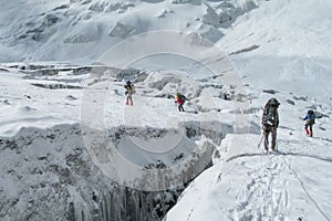 Alpinist rope team on the way to Ibn Sina, Avicenna or Lenin Peak