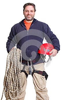 Alpinist smiling with ropes and a helmet photo