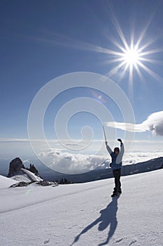 Alpinist and sun photo