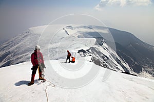 Alpinist on the top of Ostriy Tolbachik volcano. photo