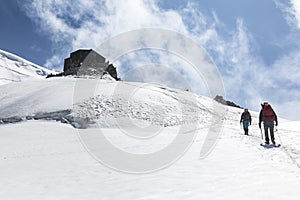Alpinists ascend to the Cosmique refuge past Col du Midi in the French Alps, Chamonix Mont-Blanc, France photo