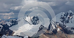 Alpinists climbing high mountain peaks snow and ice panorama landscape