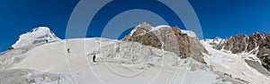 Alpinists climbing high mountain peaks snow and ice panorama landscape