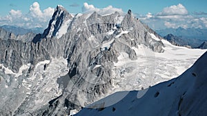 Alpinists Climbing The Montblanc Snowy Mountain