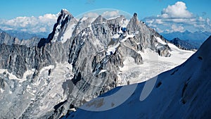 Alpinists Climbing The Montblanc Snowy Mountain