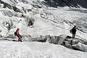 Alpinists on the glacier photo