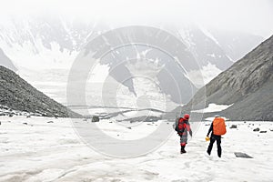 Alpinists resting on a glacier