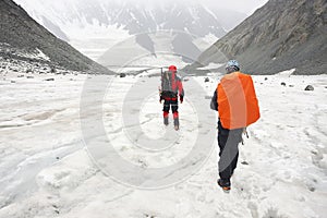 Alpinists resting on a glacier