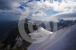 Alpinists on sheer mountain range photo