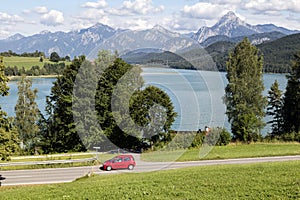 Alps, car speeding od village road