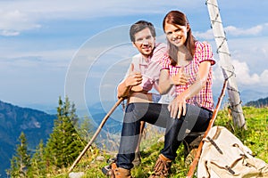 Alps - Hiking Couple takes break in mountains