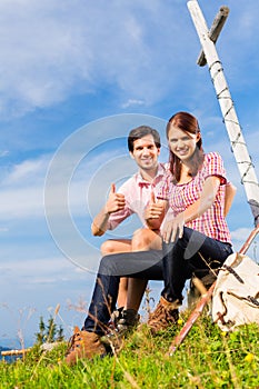 Alps - Hiking Couple takes break in mountains