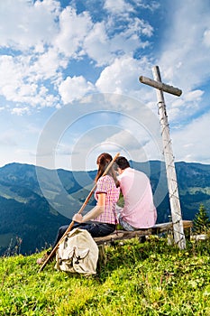 Alps - Hiking Couple takes break in mountains