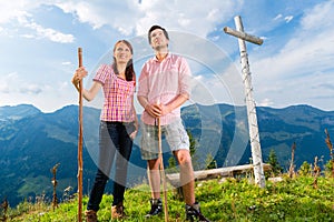 Alps - Hiking Couple takes break in mountains