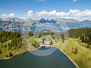 Alps mountain lake Grosssee with  the famous Churfirsten limestone ridge