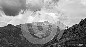 Alps mountains in clouds, black and white