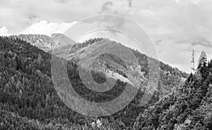 Alps mountains in clouds, black and white