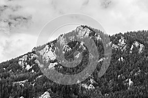 Alps mountains in clouds, black and white